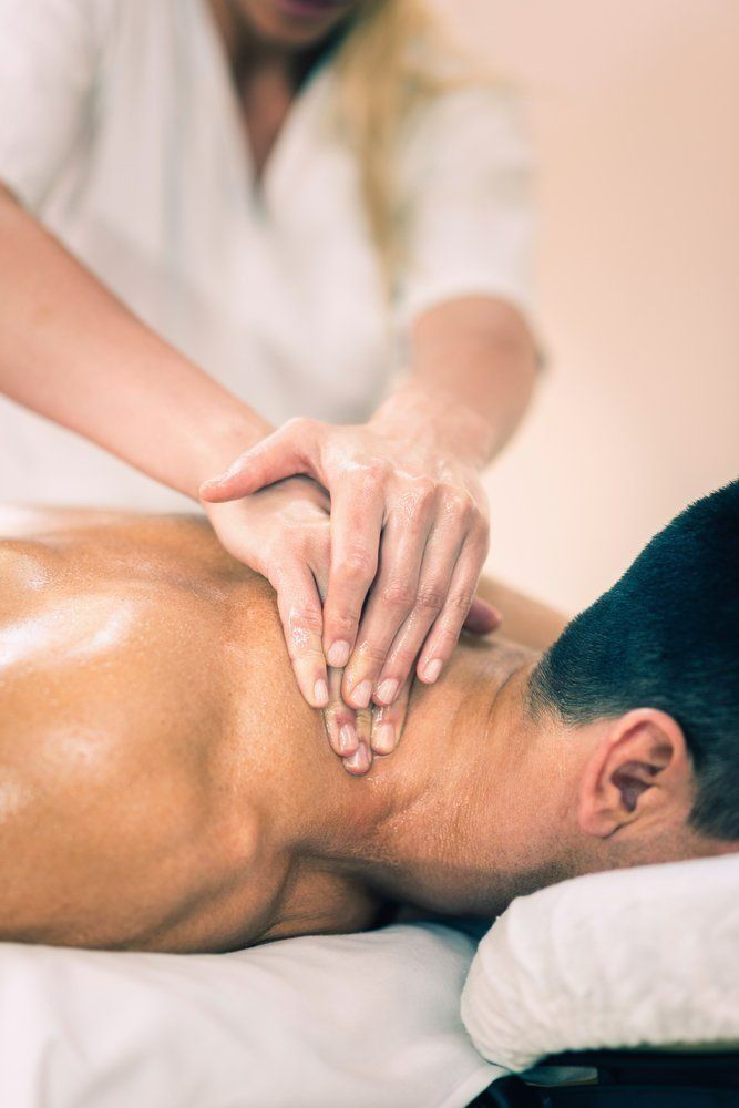 A Man is Getting a Massage at a Spa — Nancy's Traditional Thai Massage In Buderim, QLD