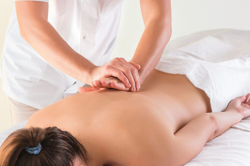 A Woman is Getting a Massage on Her Back at a Spa — Nancy's Traditional Thai Massage In Sunshine Coast, QLD