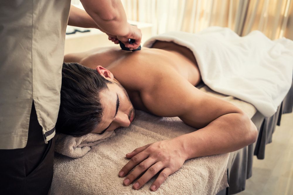 A Man is Getting a Massage at a Spa — Nancy's Traditional Thai Massage In Buderim, QLD