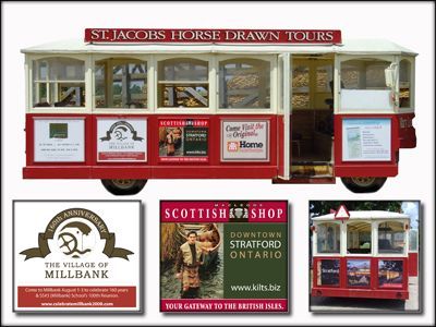 Red and white horse-drawn tour cart with advertisements for the Village of Millbank, Scottish shop, and home goods.
