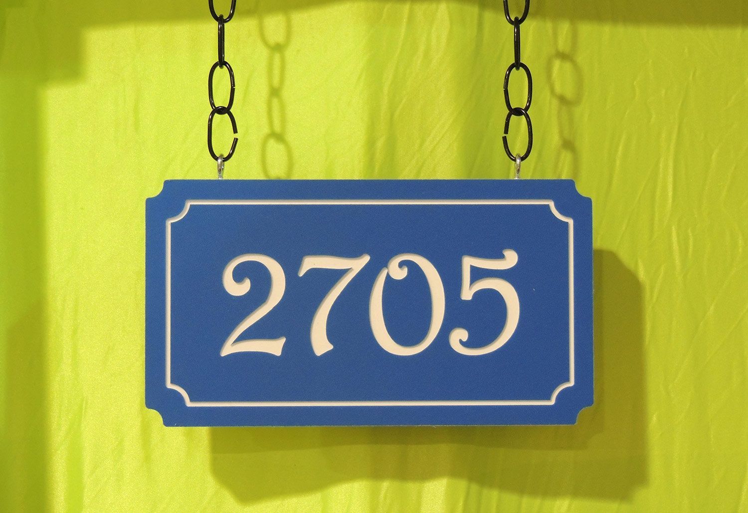 Blue house number sign