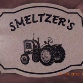 Smeltzer's sign with a tractor illustration on a beige background, black text and border.