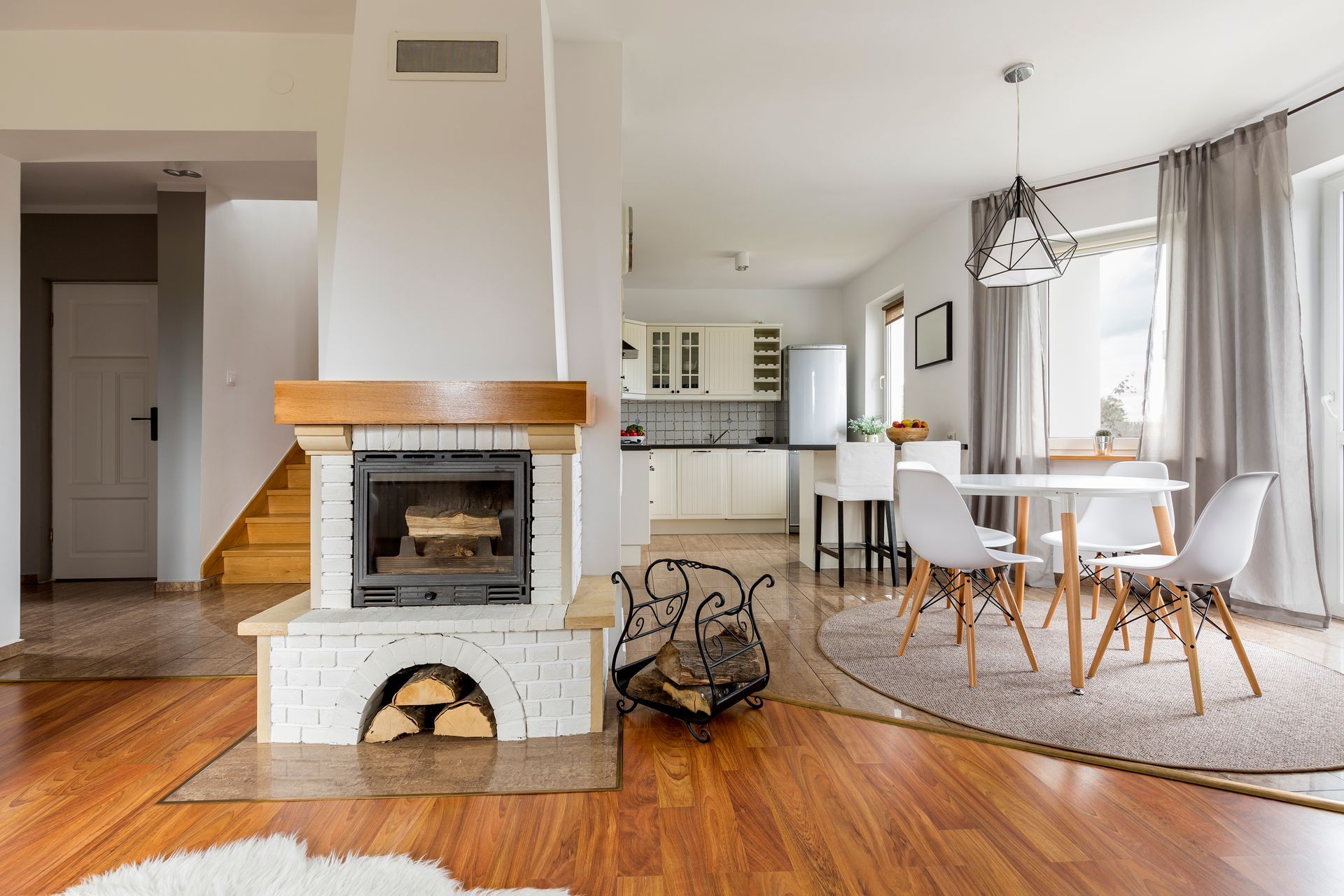 There is a fireplace in the middle of the living room.