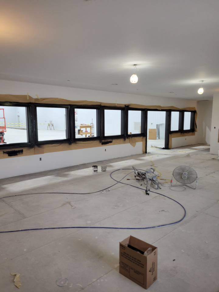 Empty Room with a Ceiling Fan and Windows — St Cloud, MN — Fine Line Paint LLC