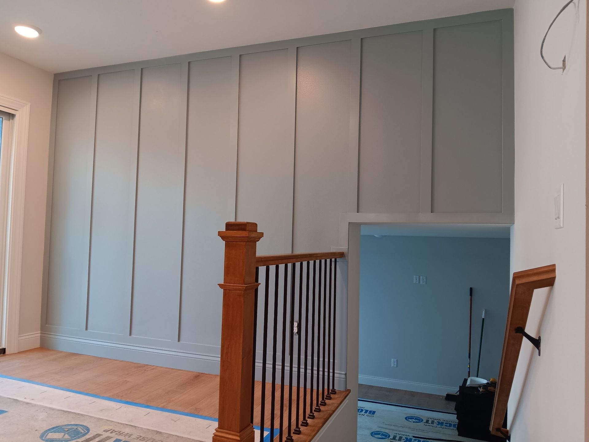 Staircase with a Railing and a Wall of Cabinets — St Cloud, MN — Fine Line Paint LLC