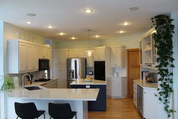 Kitchen with White Cabinets and Stainless Steel Appliances — St Cloud, MN — Fine Line Paint LLC