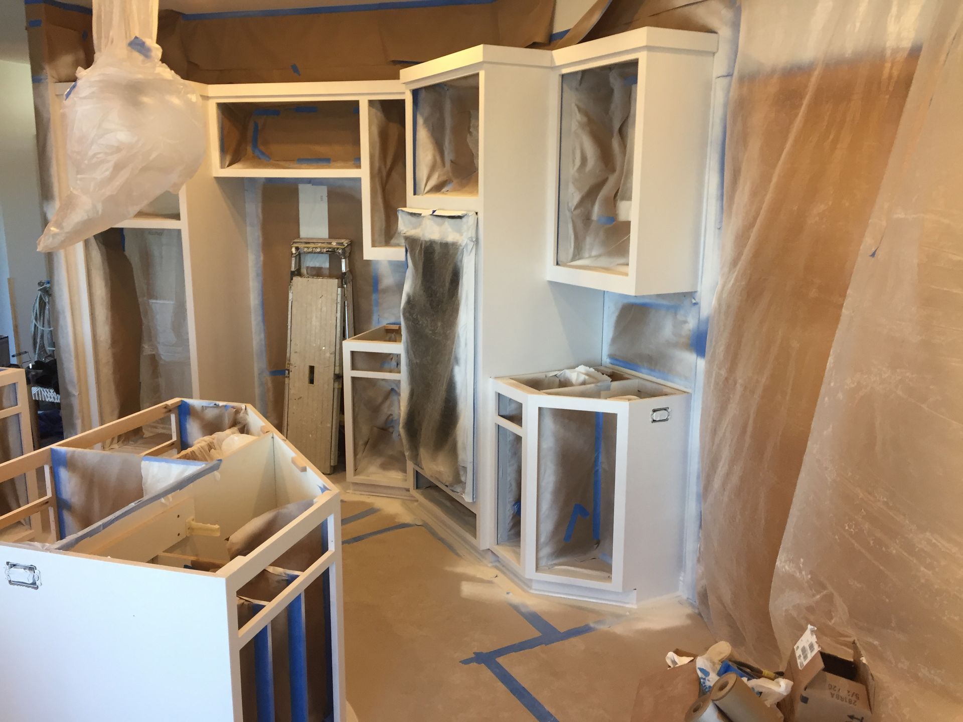 Kitchen is Painted White and Covered in Plastic — St Cloud, MN — Fine Line Paint LLC