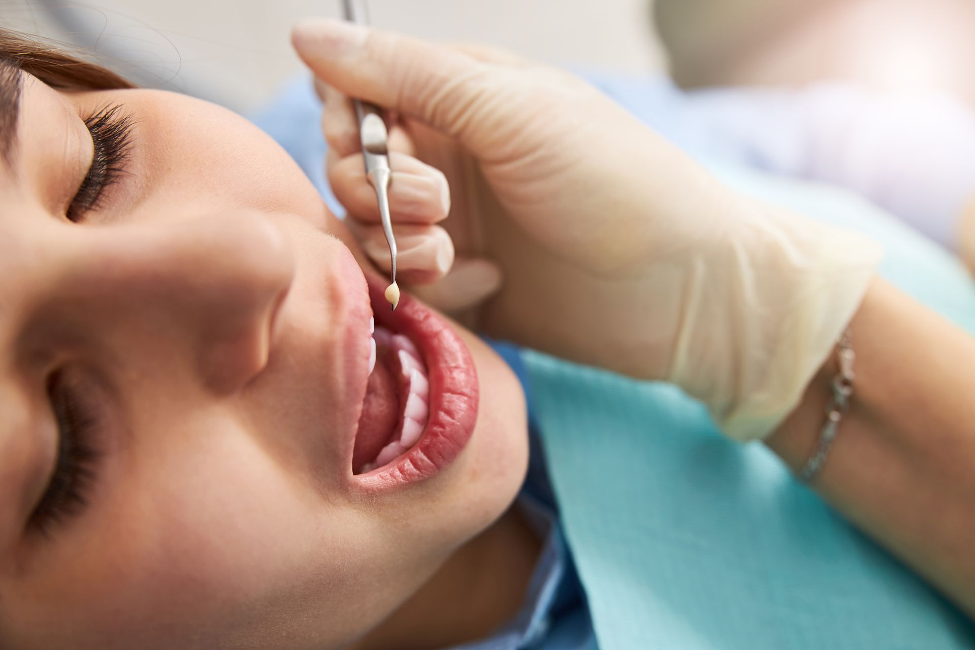 A patient is getting a dental filling.