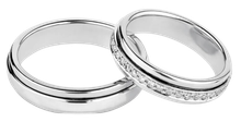 A pair of wedding rings with the website find-a-husband.com below them