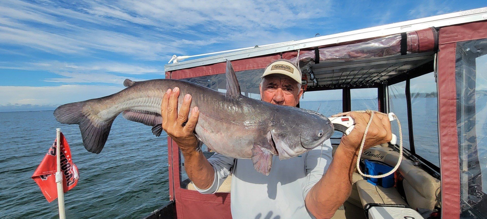 Man holding a large fish he just caught