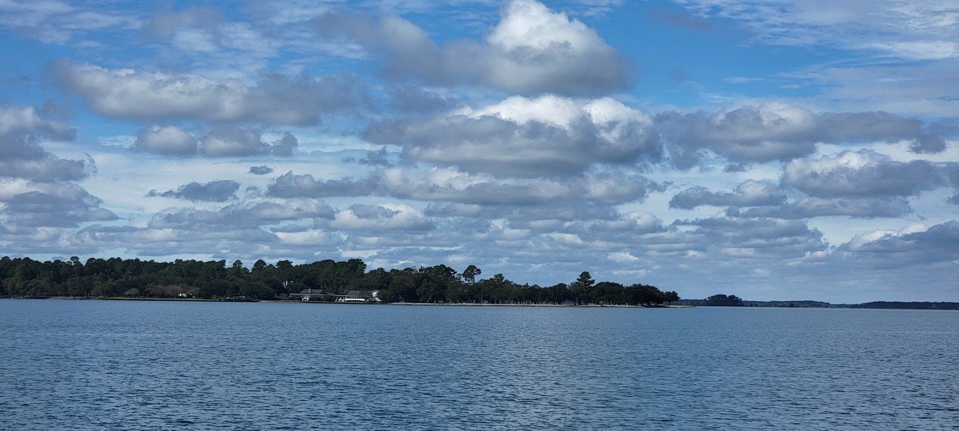 View of the lake with an abundance of clouds above