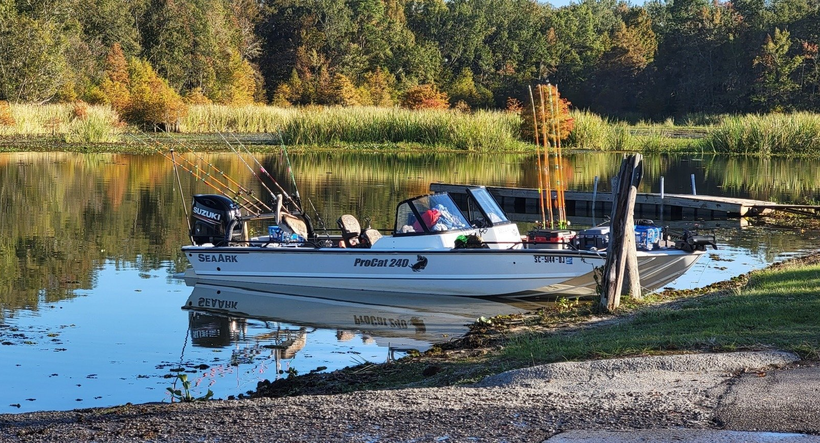 Fishing boat on the shoreline of the lake