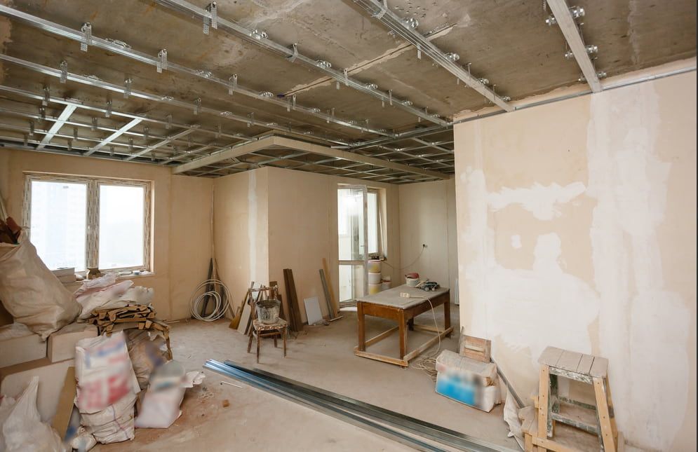 A Room That is Being Remodelled With a Table and Chairs in It — HJK Plastering In Byron Bay, NSW