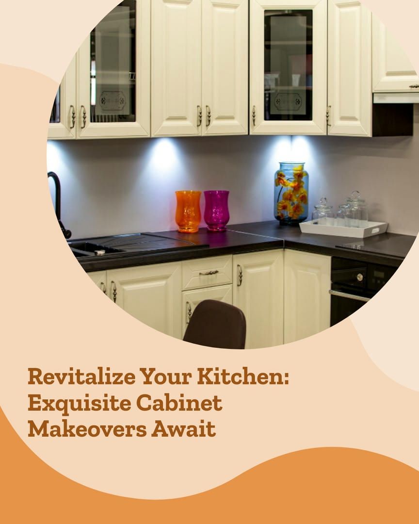 White kitchen cabinets with black countertops. Orange and purple vases on the counter.