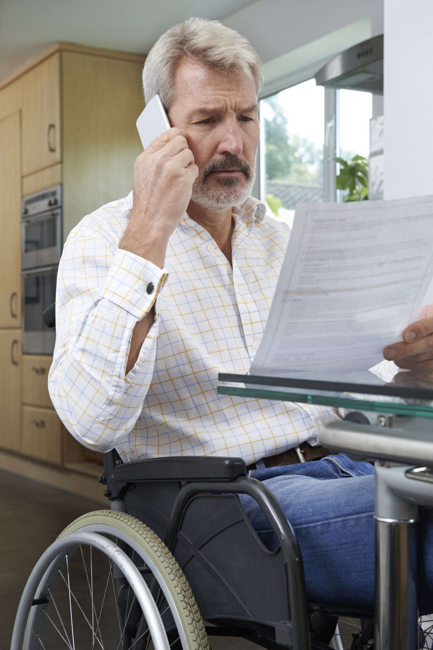 Man In Wheelchair Making Phone Call - Montgomery, AL - Arthur Leslie Attorney at Law LLC