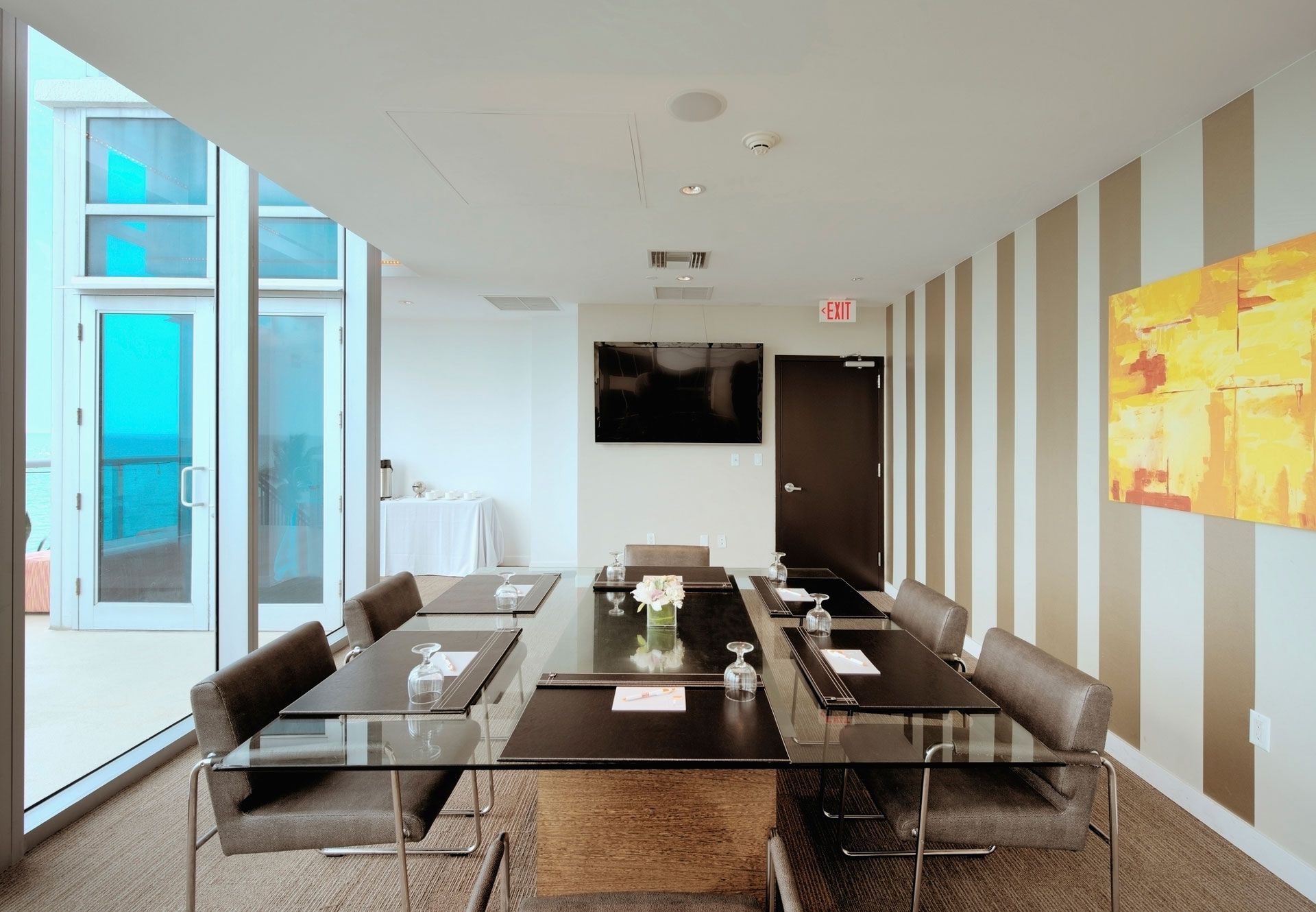 A conference room with a long table and chairs