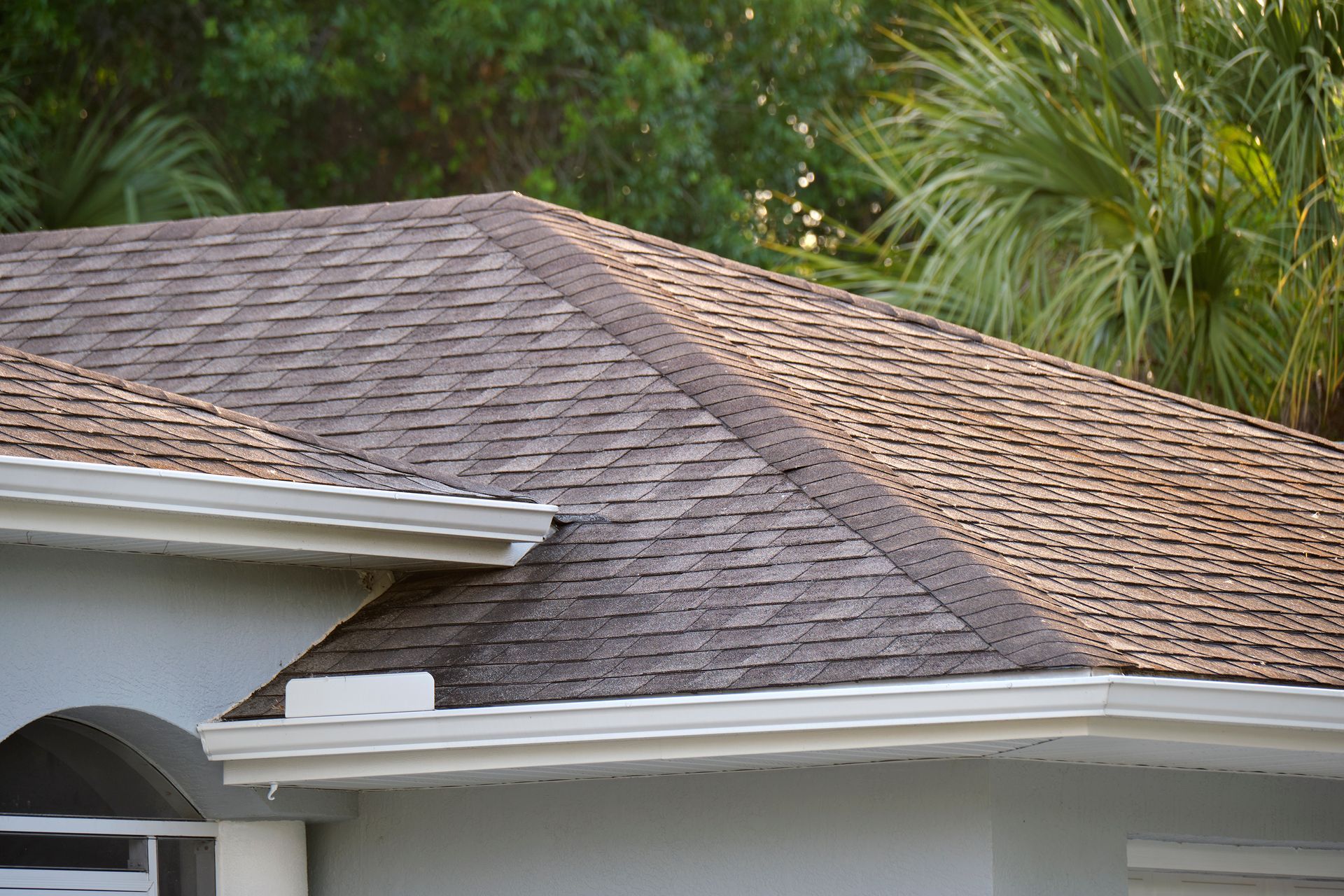 A close up of a black roof on a house.