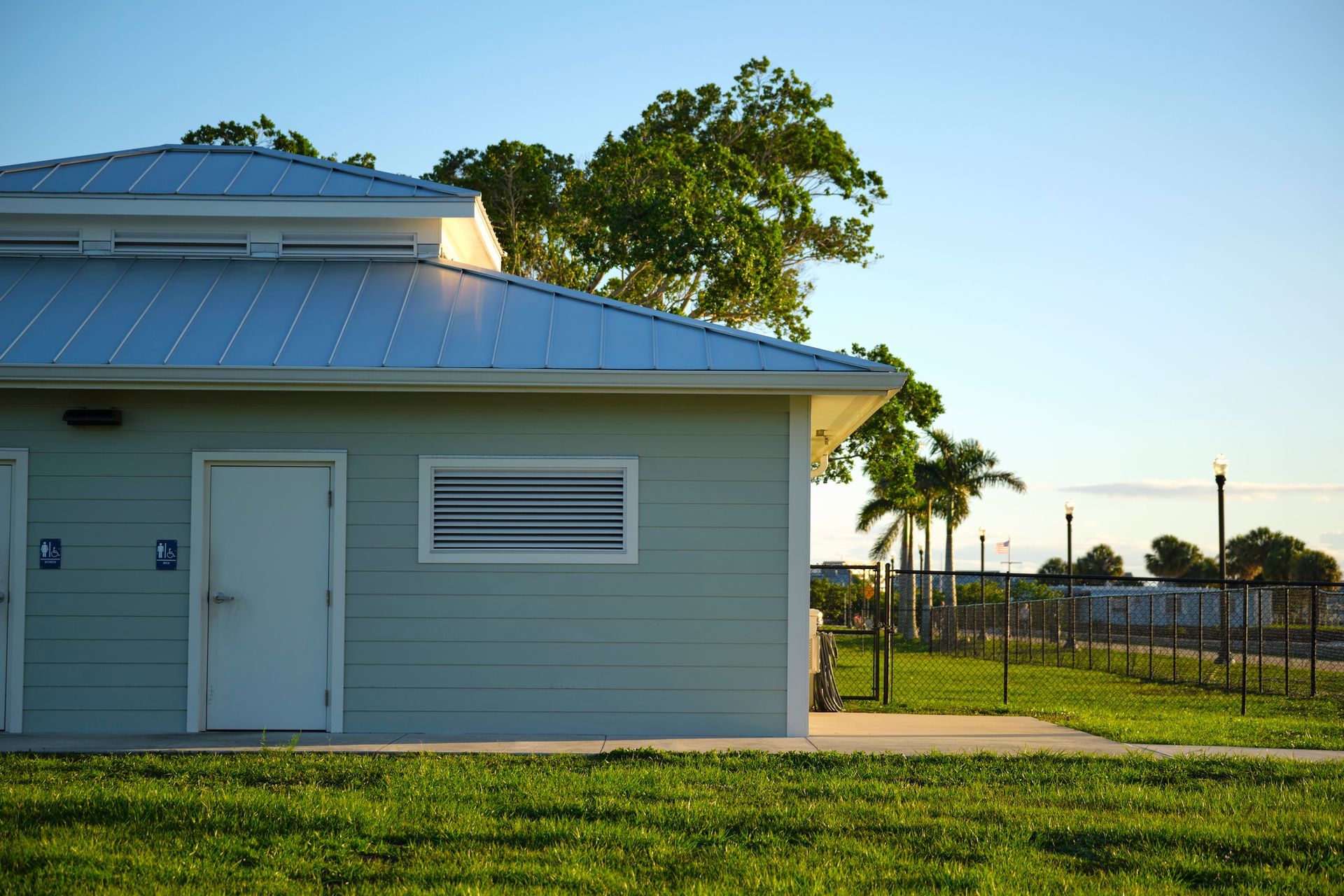 A close up of a roof with a blue sky in the background