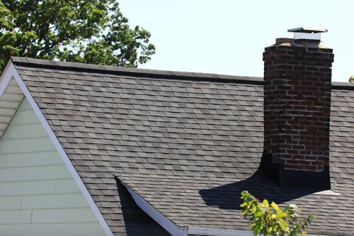 View of a Nice Asphalt Shingle Roof with a Chimney
