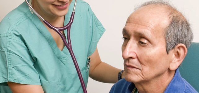 Doctor Listening to Chest of Senior Male Patient — San Marcos, CA — Care Choice Home Care