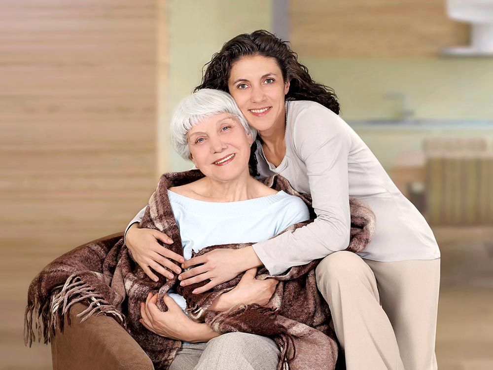 Mother and daughter smiling together indoors, symbolizing compassionate Senior In Home Care and Seni