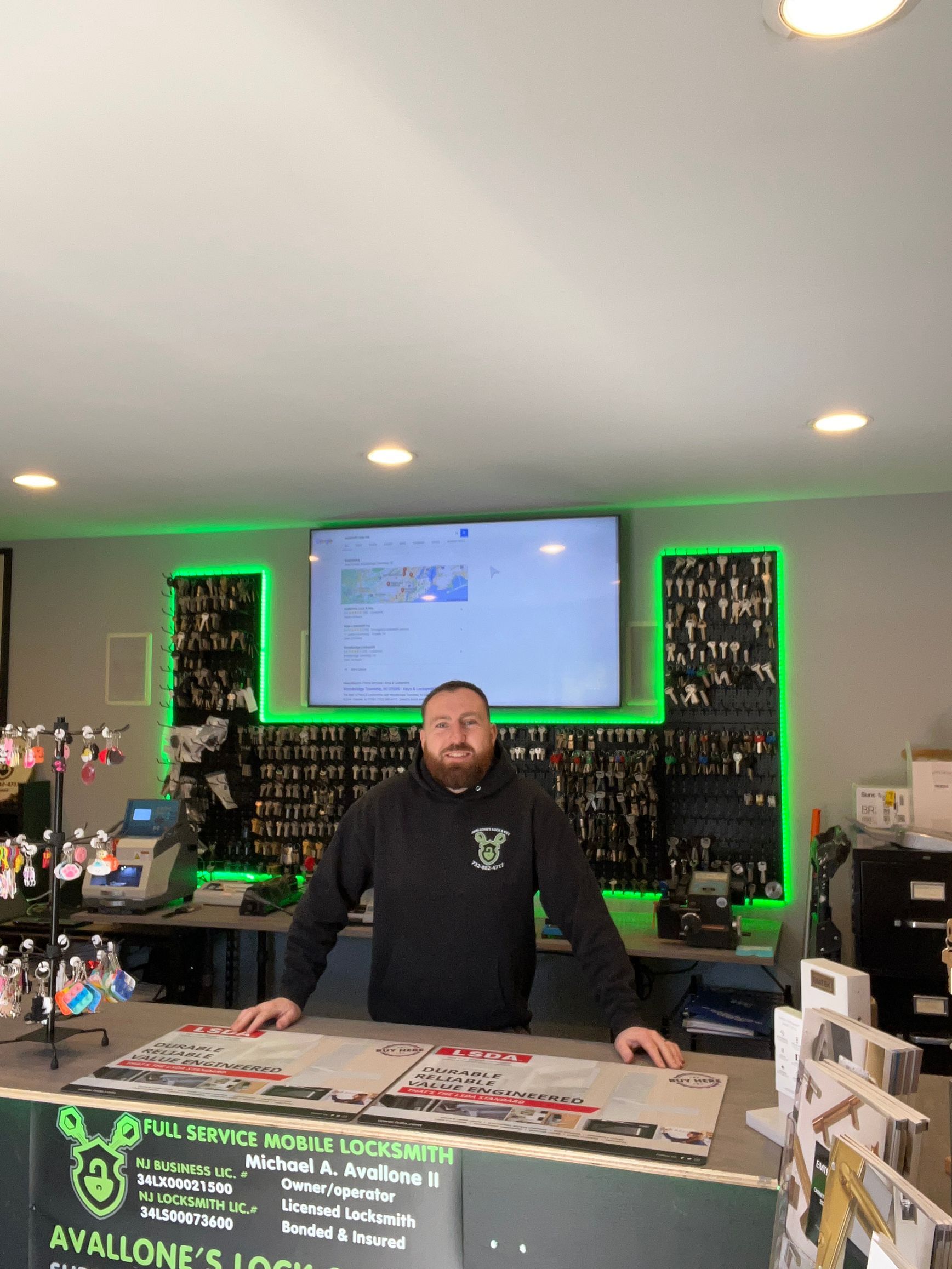 A man with a beard is standing at a counter in a store