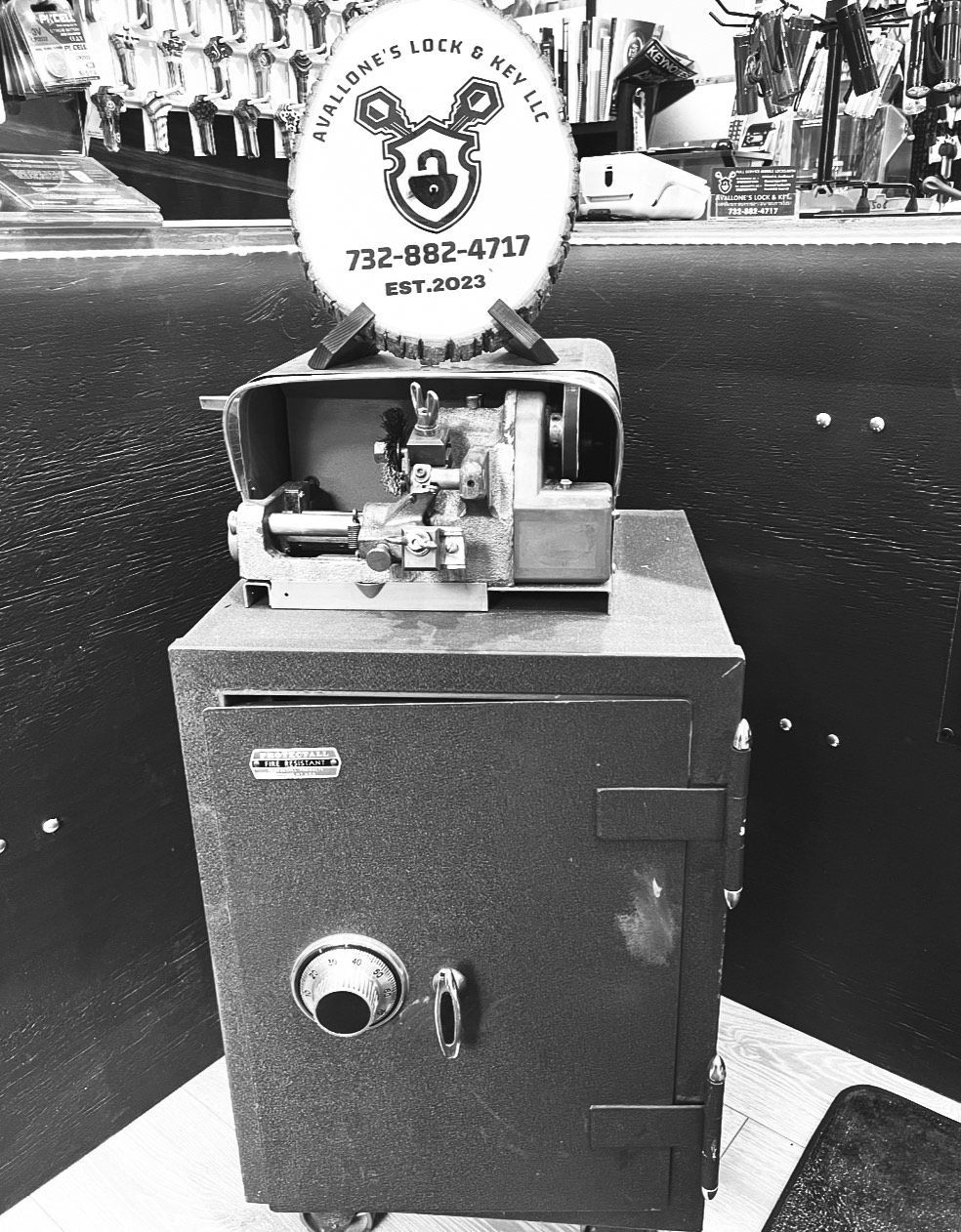 A black and white photo of a key on a door