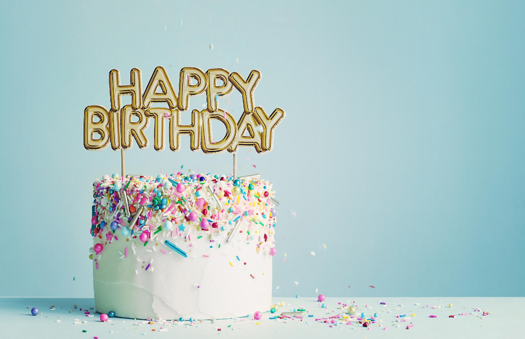 cake with happy birthday topper