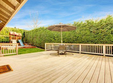 Deck Design ─ Wooden Deck With Umbrella And Patio in Lexington, KY