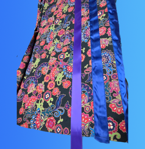 Floral print fabric with purple and blue satin ribbons.