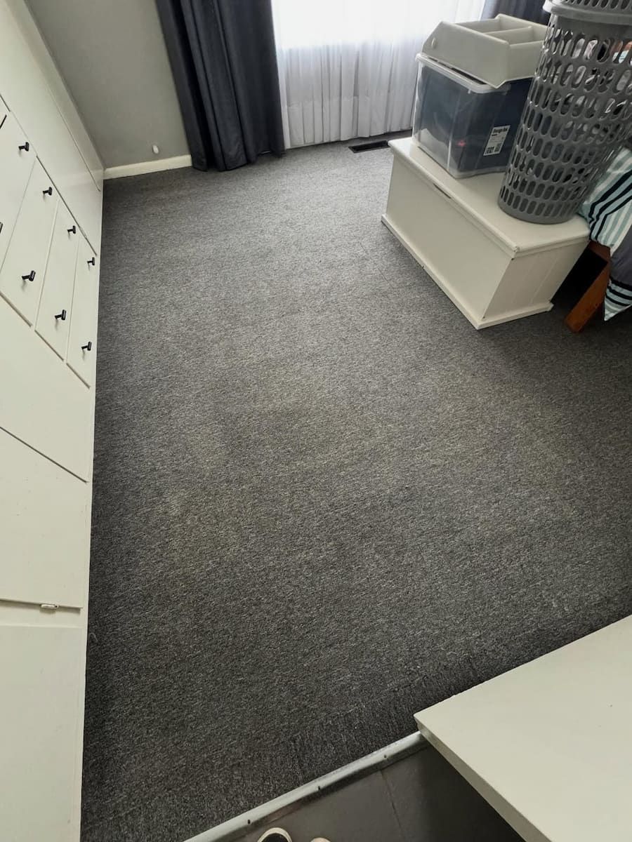 A Bedroom With Dark Grey Carpet, a White Wardrobe — Cobra's Carpet Cleaning in Junee, NSW