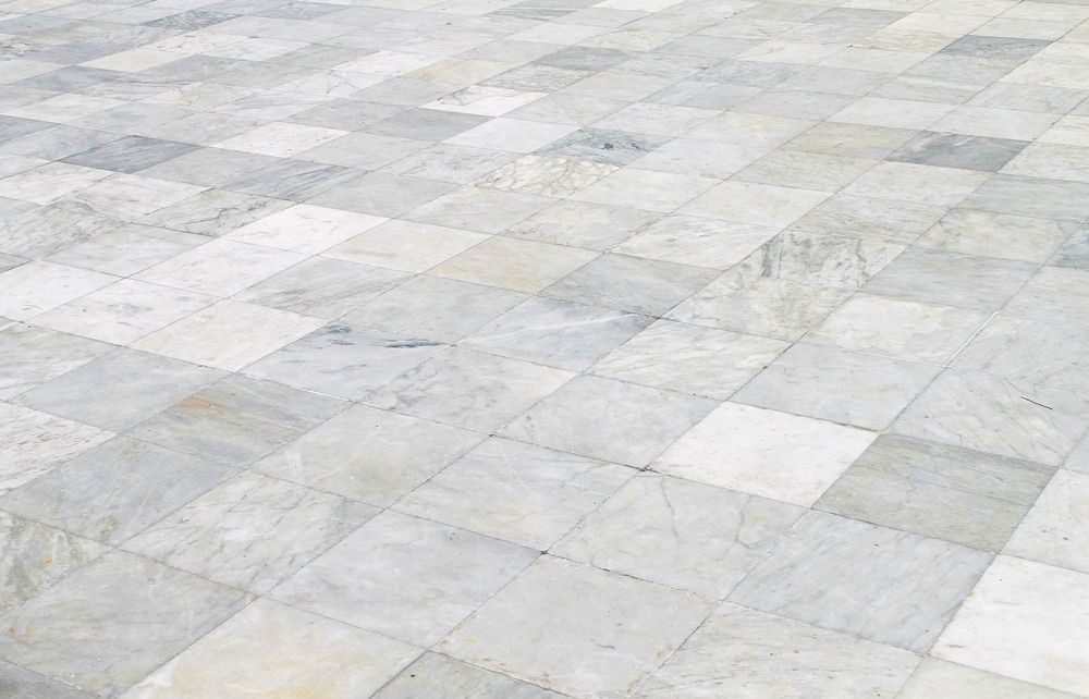 A Floor Made of Square, Light Grey and White Marble Tiles — Cobra's Carpet Cleaning in Junee, NSW