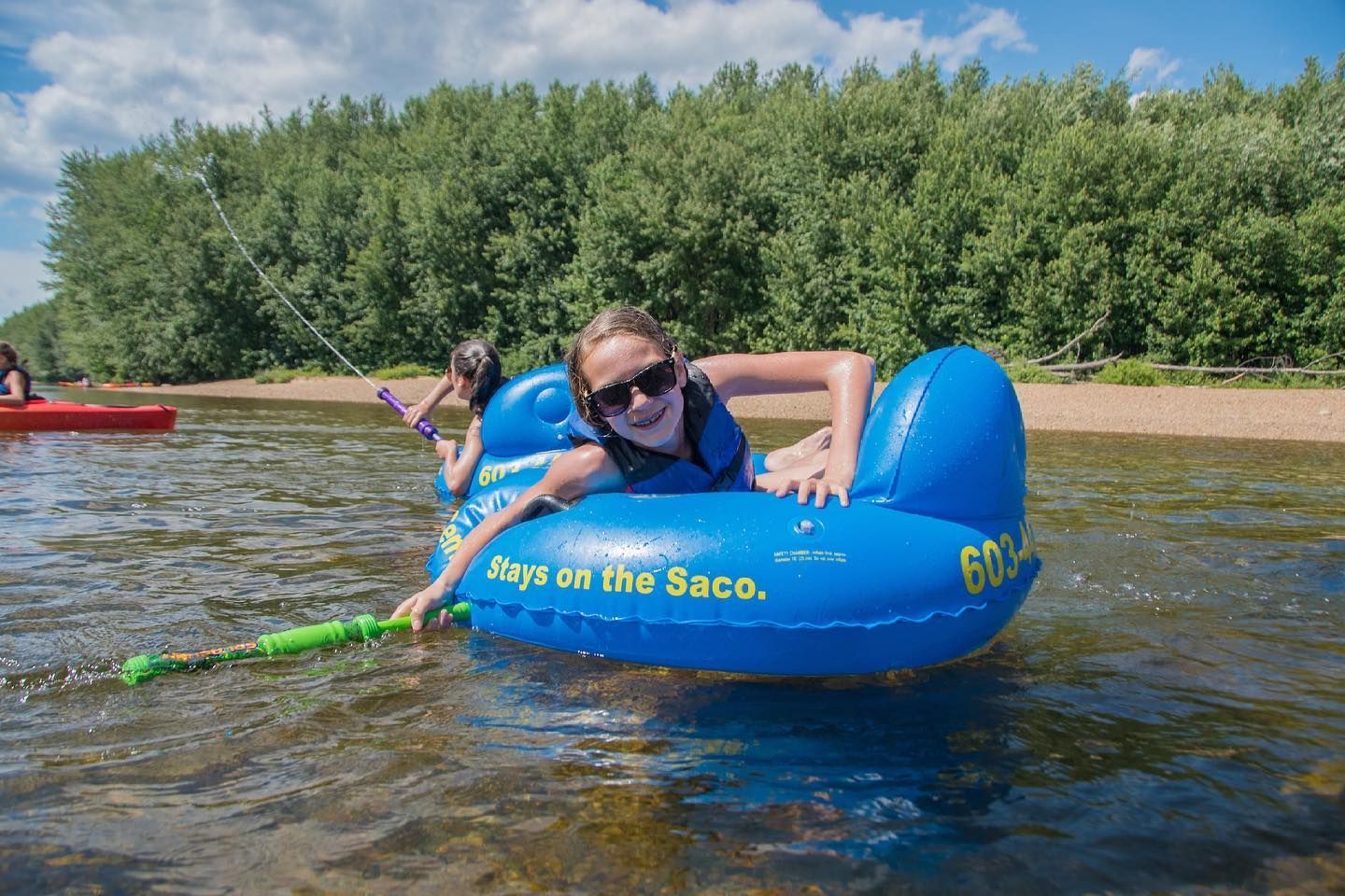 a kid on a blue river tube