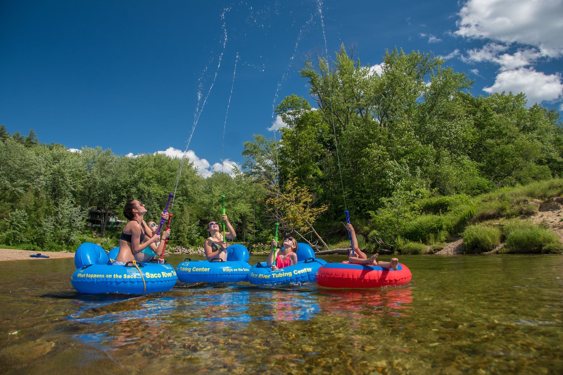 people playing on a river tub