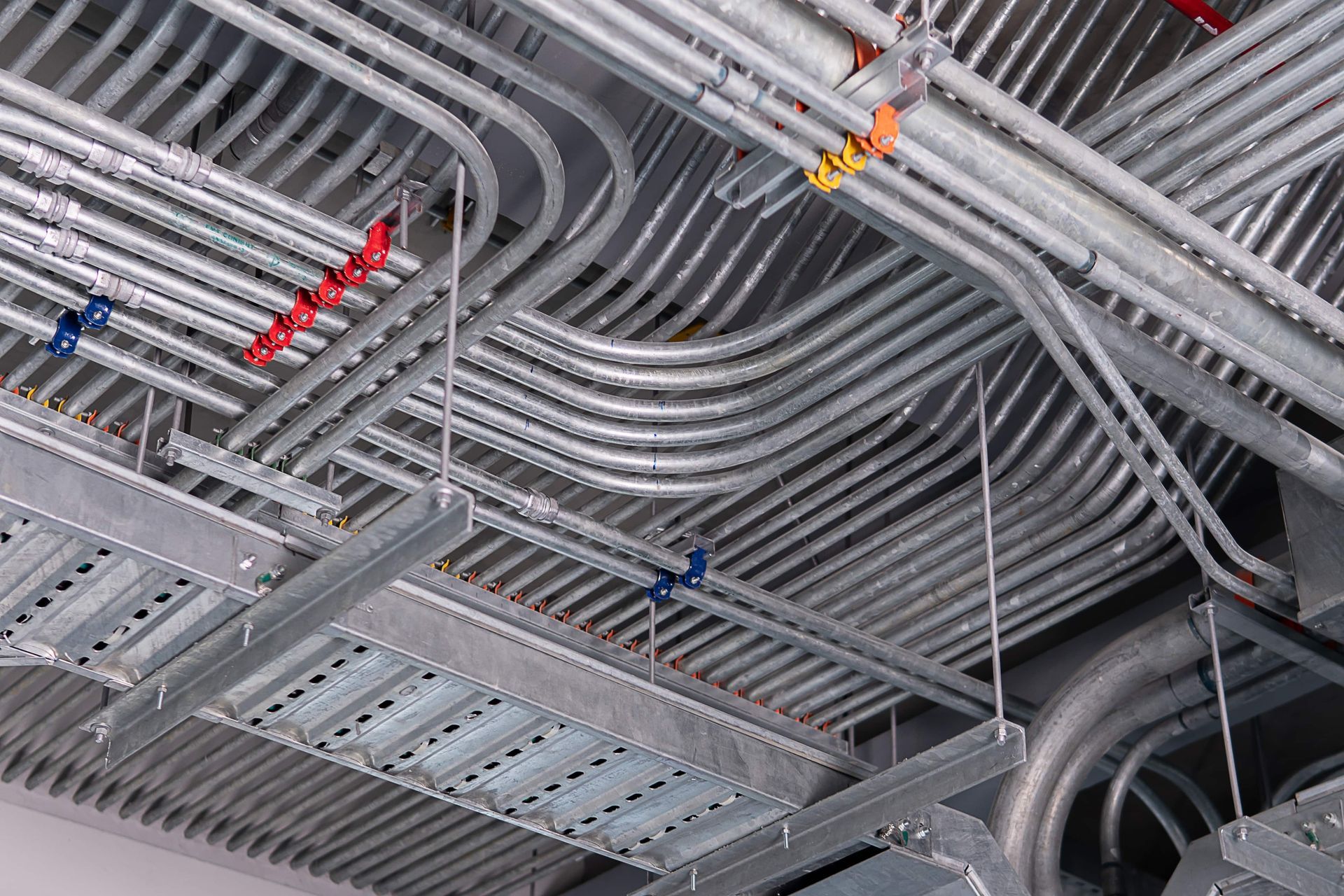 Electrical conduit for cable routing between electrical distribution panel with equipment at bottom of upper floor.