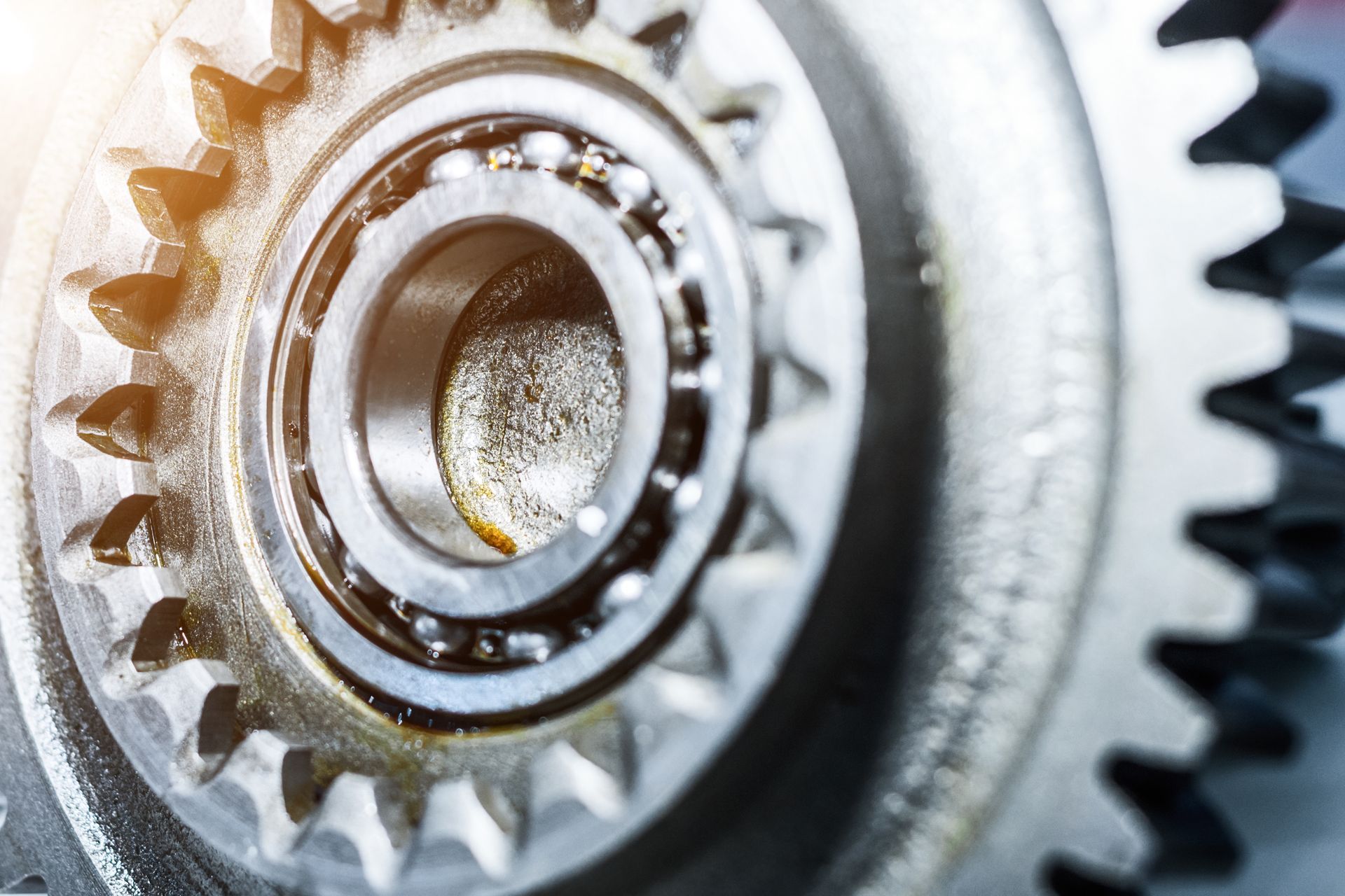 High-quality steel gears and bearings used in industrial gear manufacturing processes and tools.