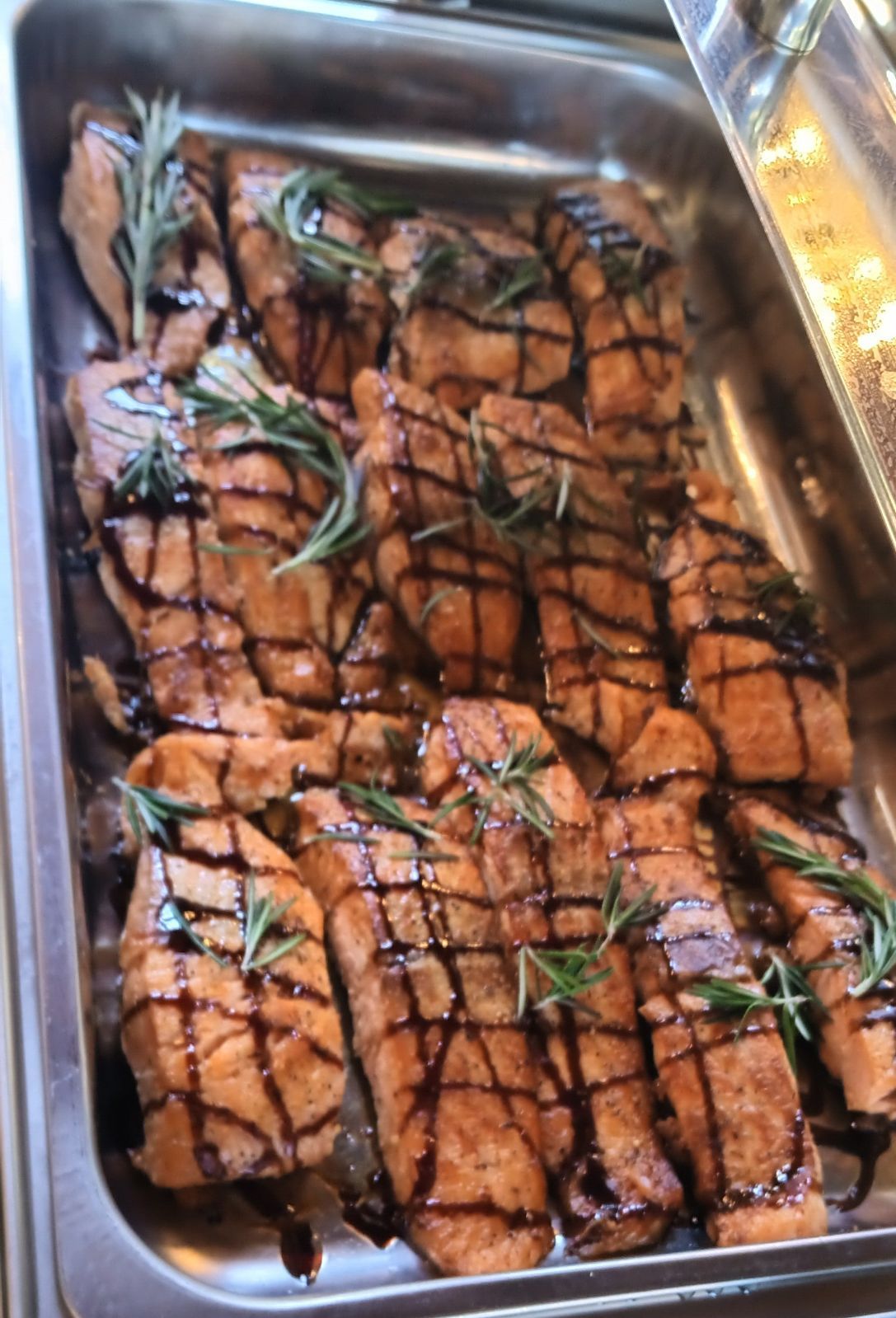 A tray of food with meat and sauce on it