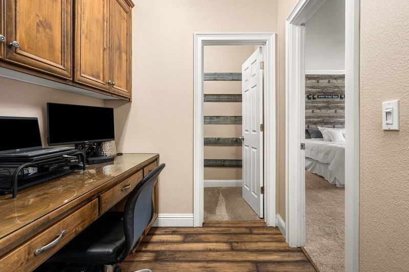 Home office on La Guardia Circle with desk, computer, and printer setup.