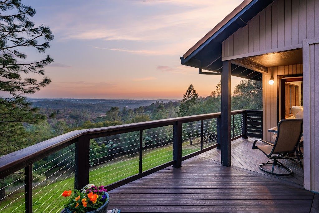 A large house with a porch and a walkway leading to it.
