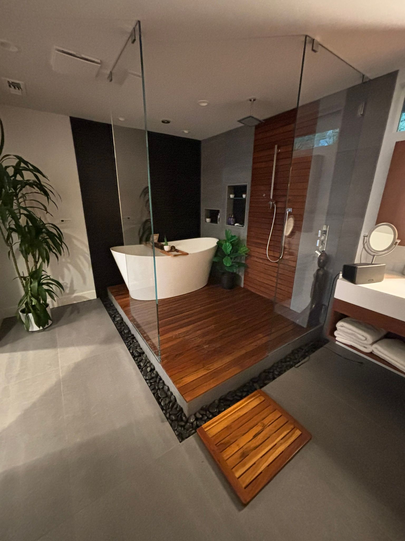 A bathroom with a bathtub and a walk in shower
