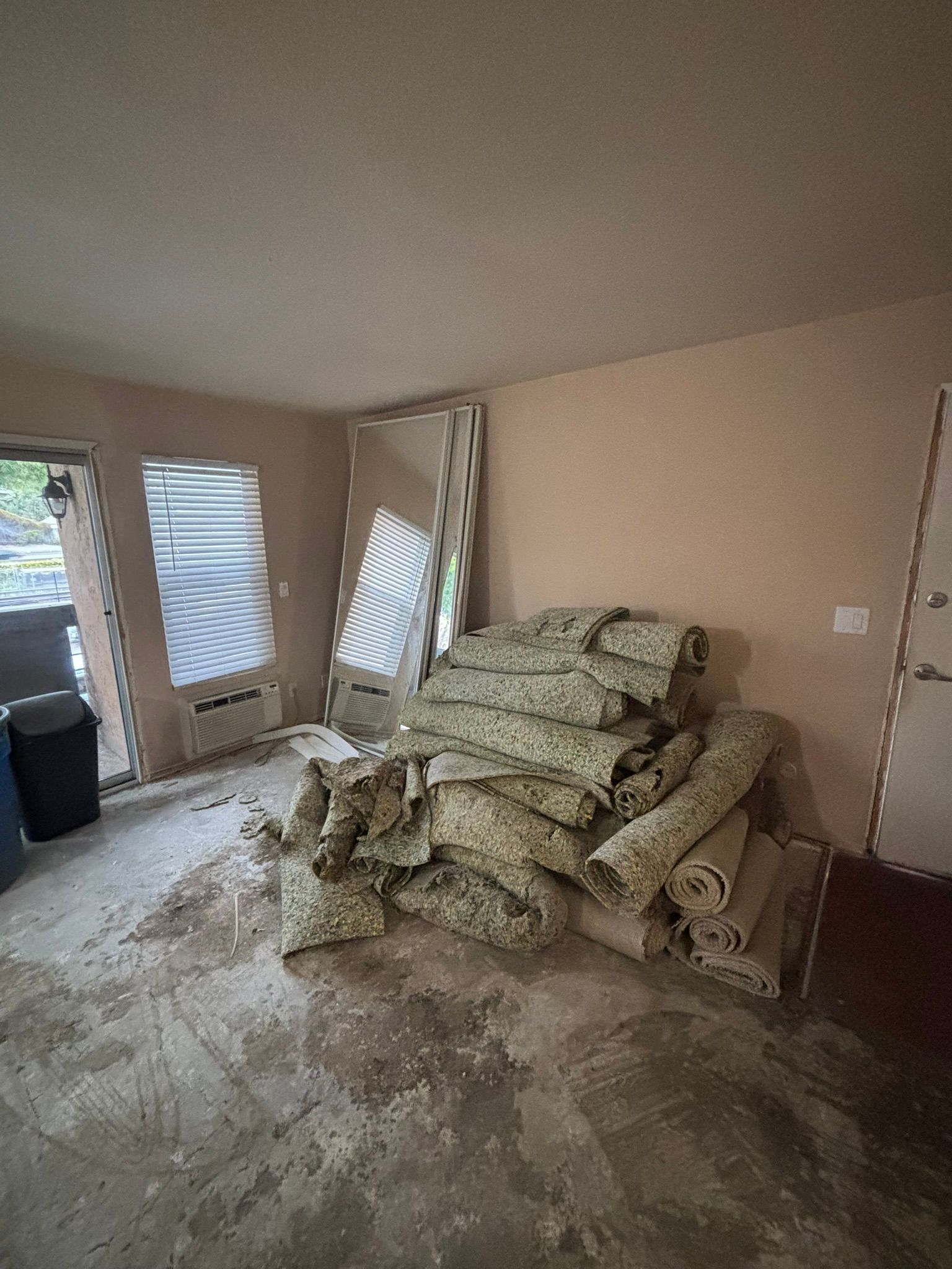 There is a pile of carpet in the middle of the room.