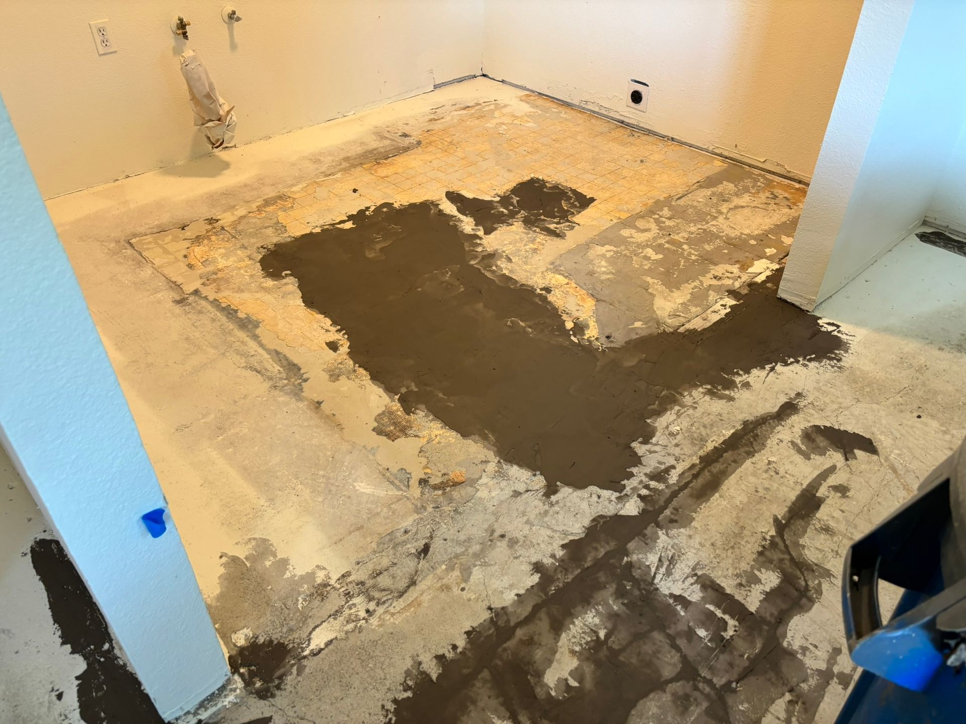 A room with a lot of dirt on the floor.