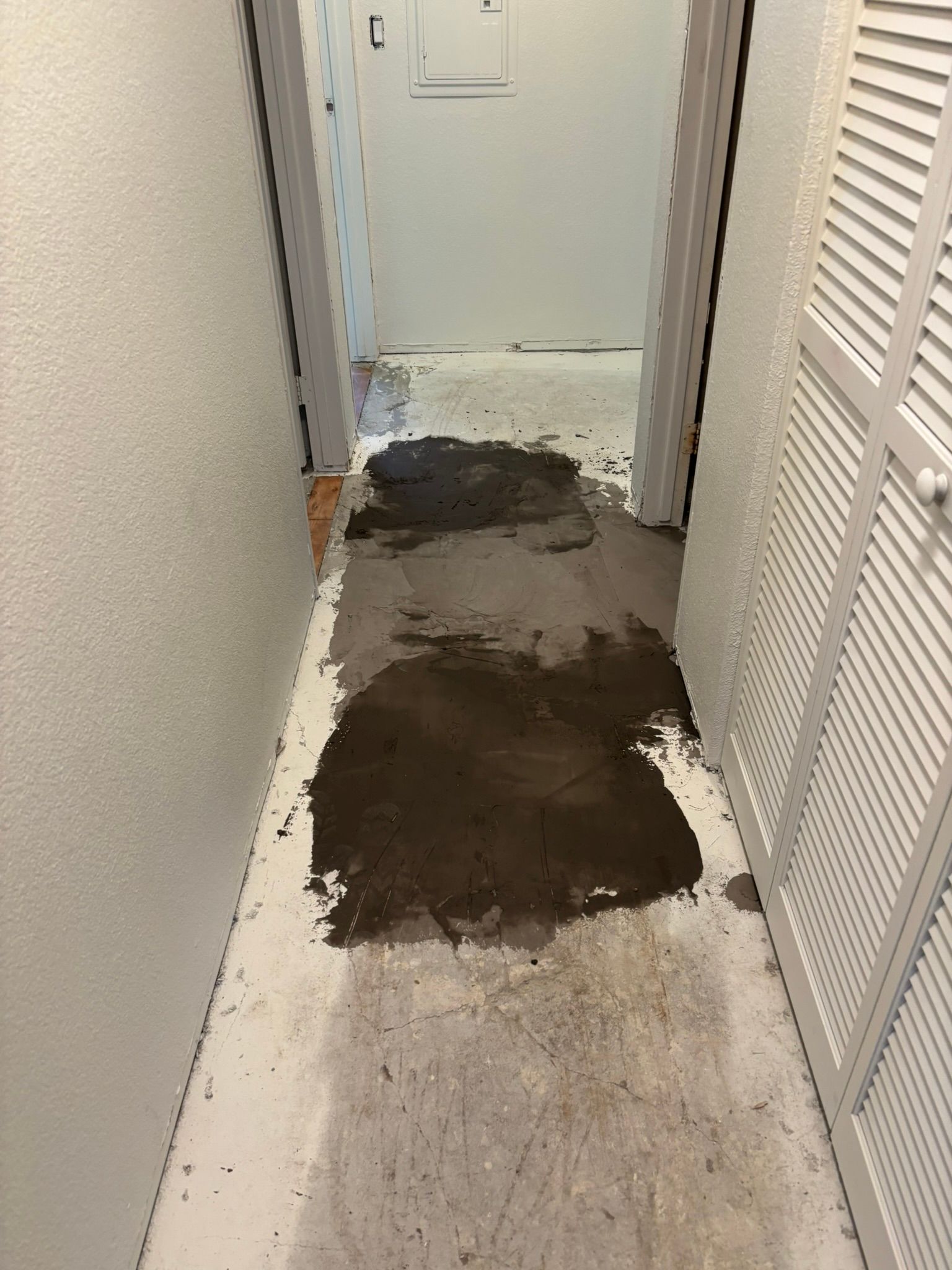 A hallway with a lot of dirt on the floor.
