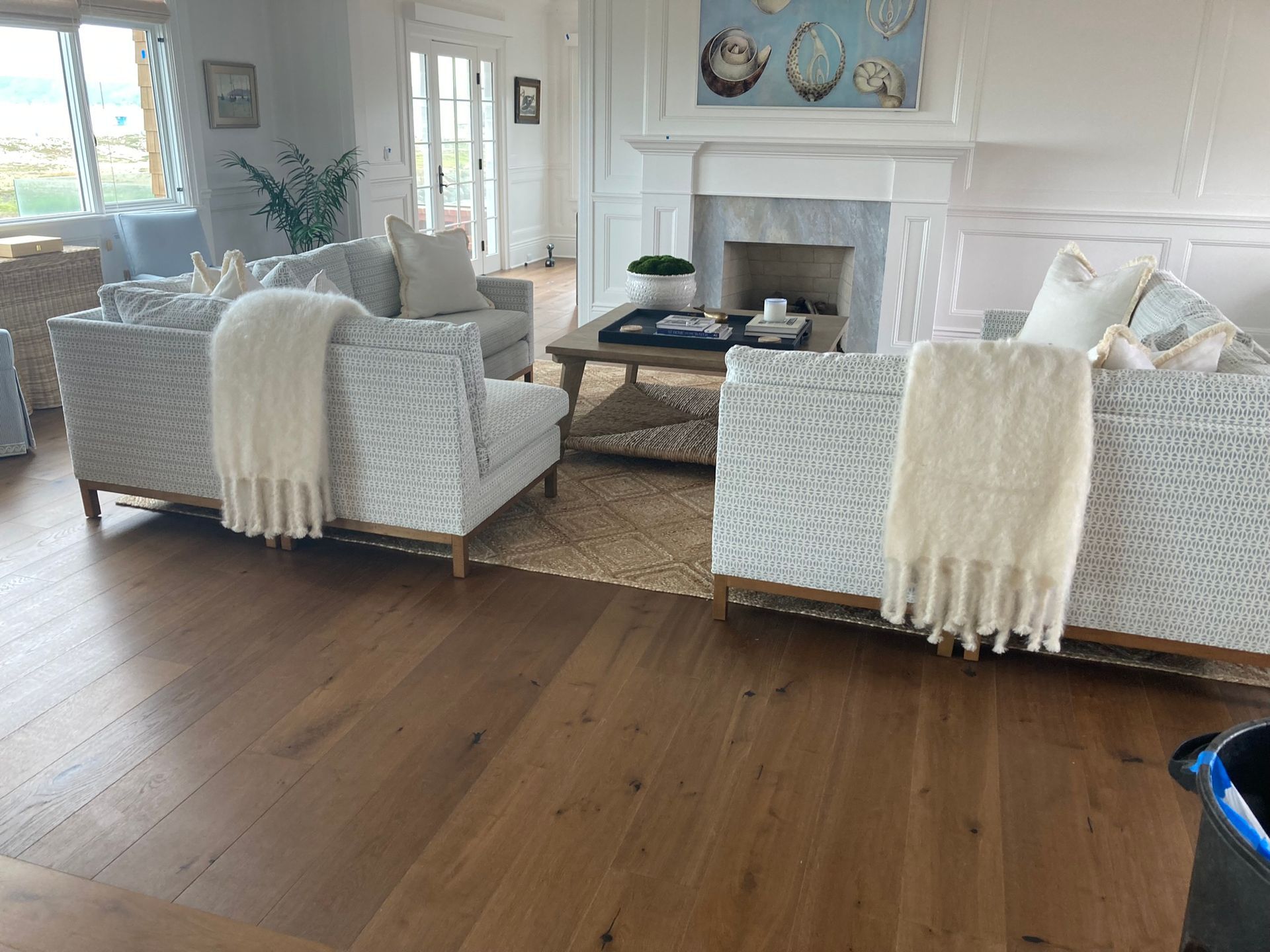 A living room filled with furniture and a fireplace.