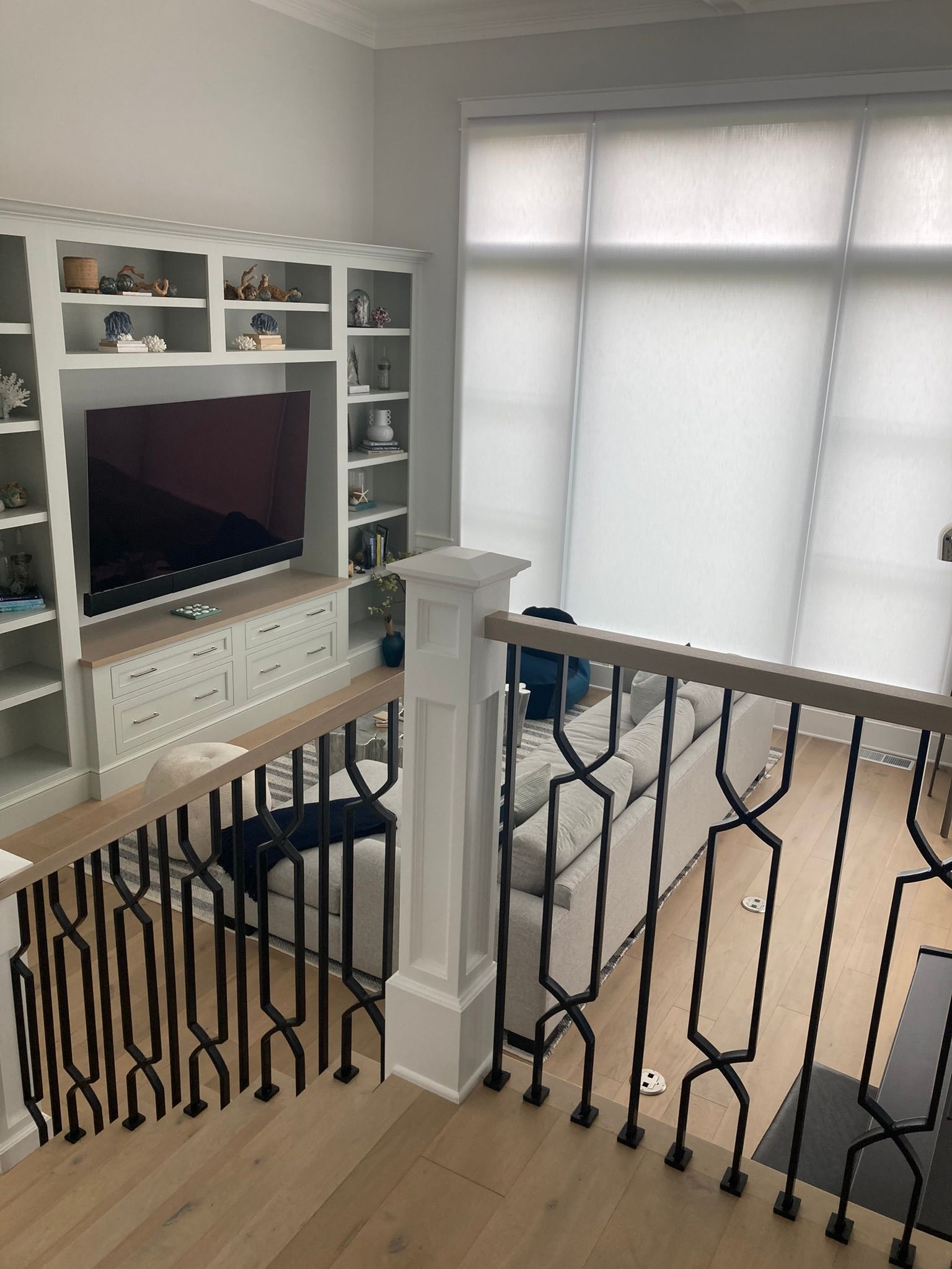 A living room with a couch and a flat screen tv