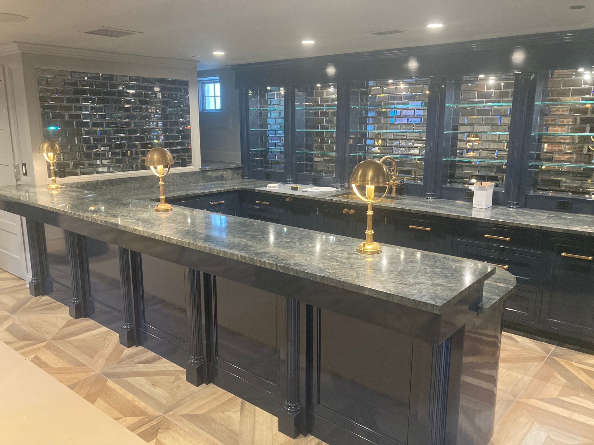 A kitchen with a long counter and a lot of cabinets.