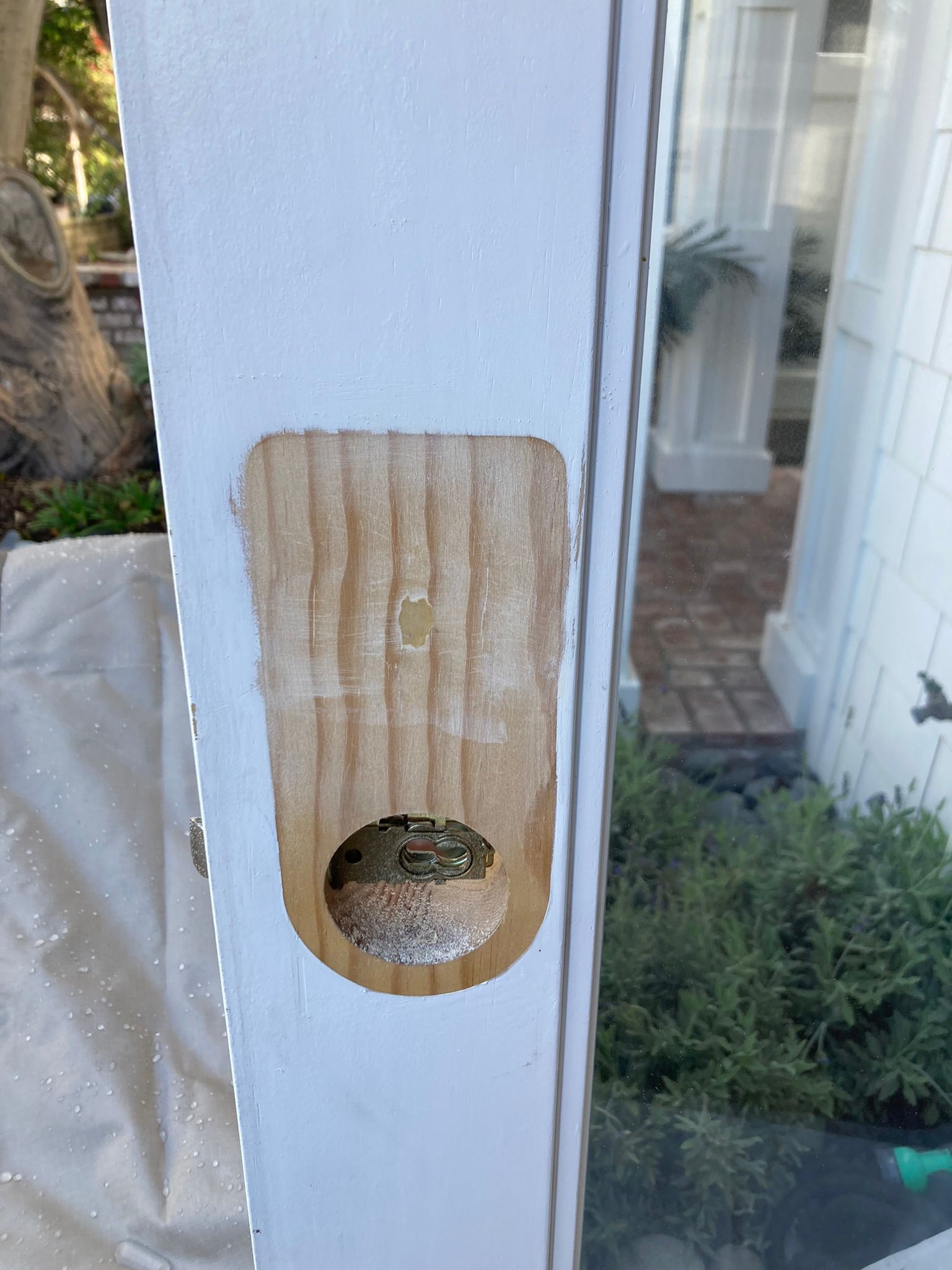 A close up of a door with a hole in it.