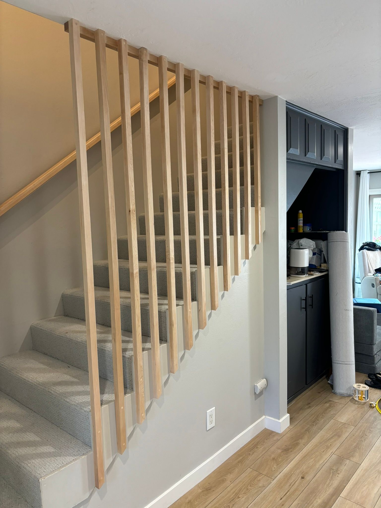 A staircase with a wooden railing in a house.