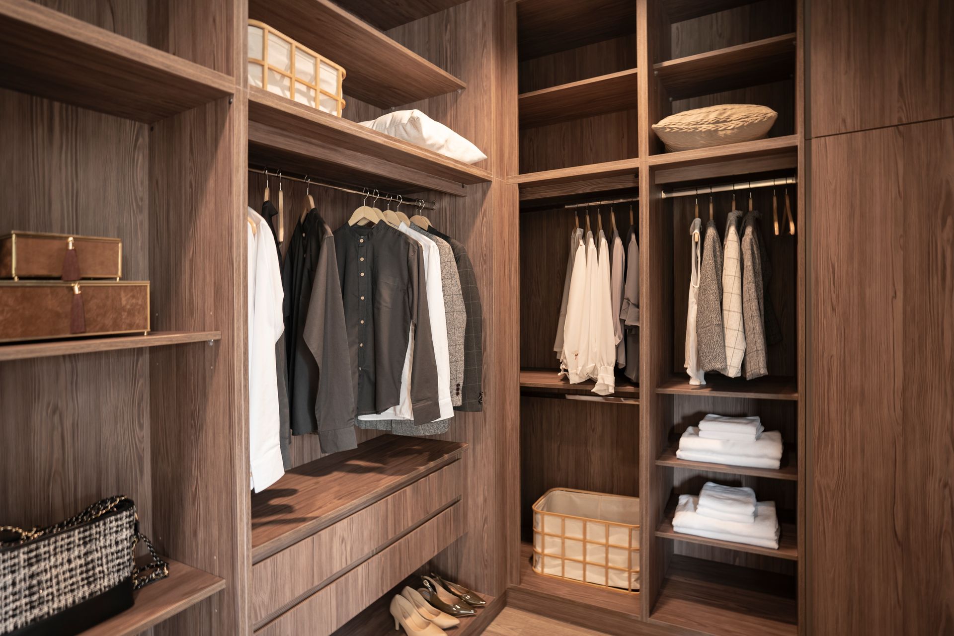 A white closet is sitting in a kitchen next to a staircase.
