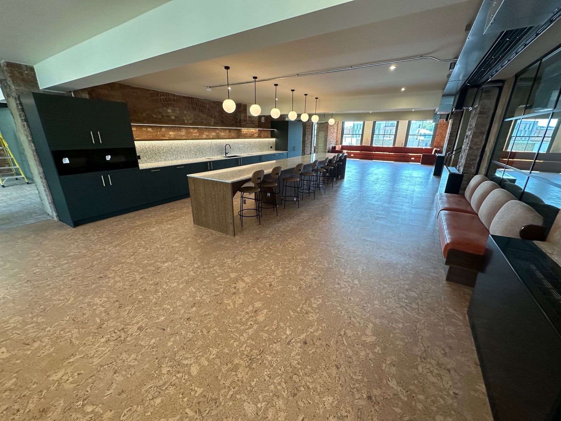 A large room with a dining table and chairs in it.